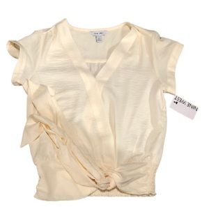 A light yellow women’s Xs top